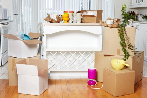Local house removals in Clapham with moving van and packed boxes
