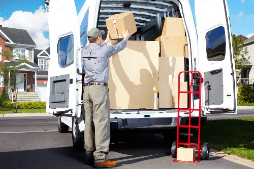 Clapham resident loading boxes into a mobile storage container